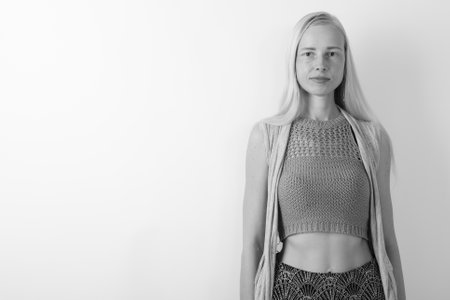 Beautiful blond woman against white backgroundの写真素材