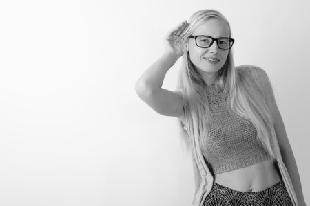 Beautiful blond woman against white backgroundの写真素材