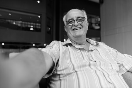 Overweight senior tourist man exploring around the city of Bangkok, Thailandの写真素材