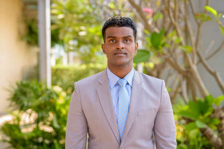 Portrait of handsome young African businessman wearing suitの写真素材