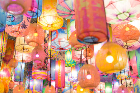 Traditional colorful lantern lights outdoors at nightの写真素材