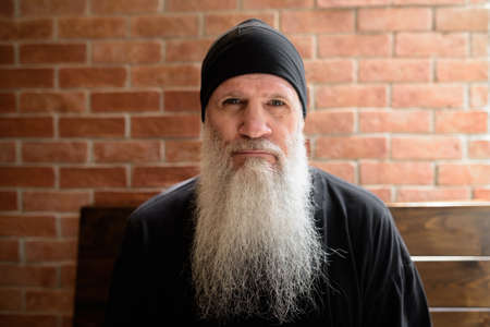 Portrait of mature man with long gray beardの写真素材