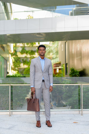 Portrait of handsome young African businessman wearing suitの写真素材