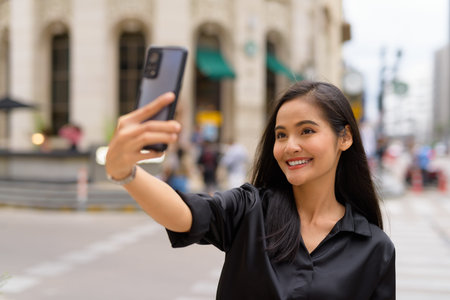 Portrait of beautiful Asian businesswoman outdoors at Bangkok Thailand