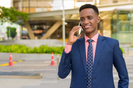 Portrait of young African businessman wearing suit and tieの写真素材