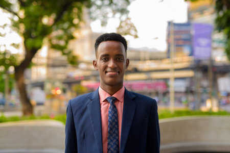 Portrait of young African businessman wearing suit and tie