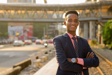 Portrait of young African businessman wearing suit and tie