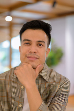 Portrait of handsome young man at coffee shop
