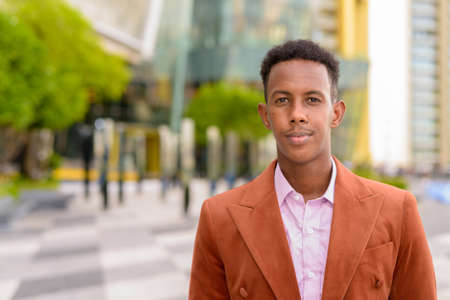 Portrait of handsome young black African businessman wearing stylish clothesの写真素材