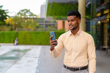 Portrait of young handsome African businessman wearing stylish clothesの写真素材