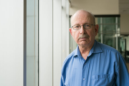 Portrait of senior businessman looking at camera