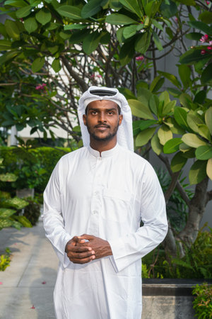 Portrait of young African Muslim man wearing religious clothing an scarf