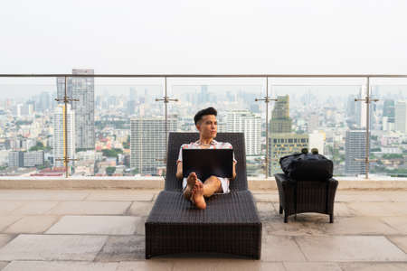 Portrait of handsome young cool stylish man during summerの写真素材