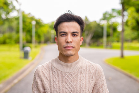 Portrait of young man in park during summerの写真素材
