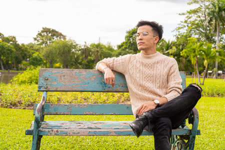 Portrait of young man in park during summerの写真素材