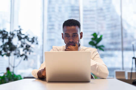 Portrait of young handsome stylish black man enjoying city lifeの写真素材