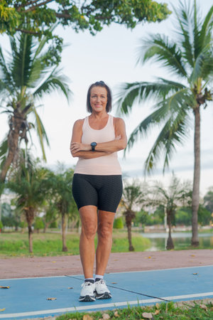 Portrait of a mature woman in park exercising during summer conceptの写真素材