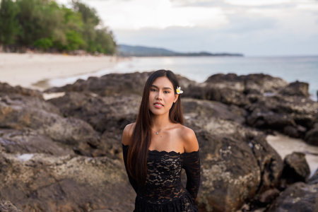 Portrait of beautiful young Asian woman during summer beach holidayの写真素材