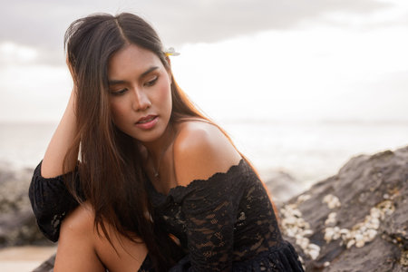 Portrait of beautiful young Asian woman during summer beach holiday