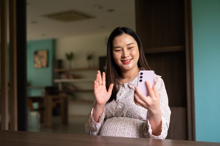 Pregnant Asian woman portrait indoors