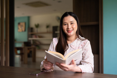 Pregnant Asian woman portrait indoorsの写真素材