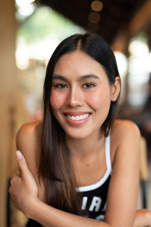Portrait of beautiful young woman in coffee shop