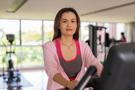 Portrait of Asian fitness woman exercising in gymの写真素材