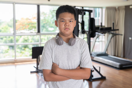 Young Confident Teen Boy Working Out in Gym Portraitの写真素材