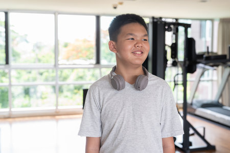 Young Confident Teen Boy Working Out in Gym Portraitの写真素材