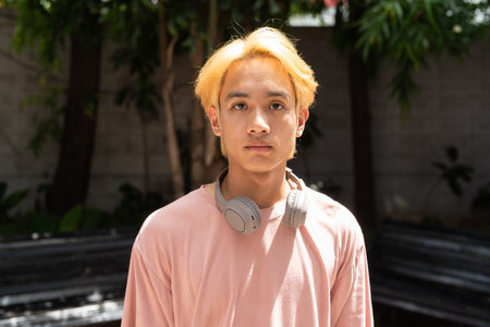 Man with septum piercing nose ring looking at cameraの写真素材