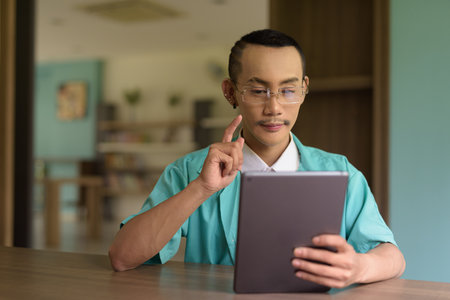 Portrait of non binary gay man doctorの写真素材