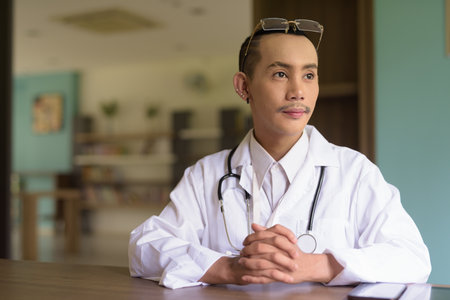 Portrait of non binary gay man doctorの写真素材