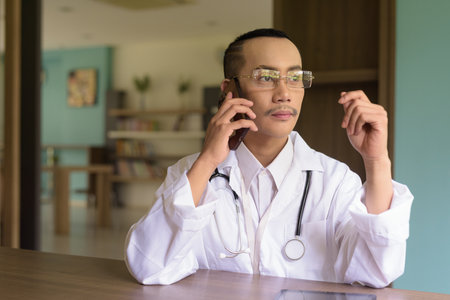 Portrait of non binary gay man doctorの写真素材