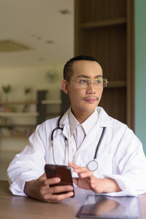 Portrait of non binary gay man doctorの写真素材