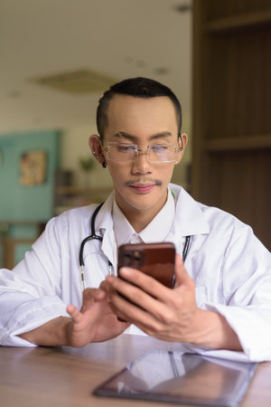 Portrait of non binary gay man doctorの写真素材