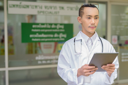 Portrait of non binary gay man doctorの写真素材