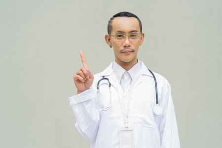 Portrait of non binary gay man doctorの写真素材