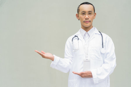 Portrait of non binary gay man doctor