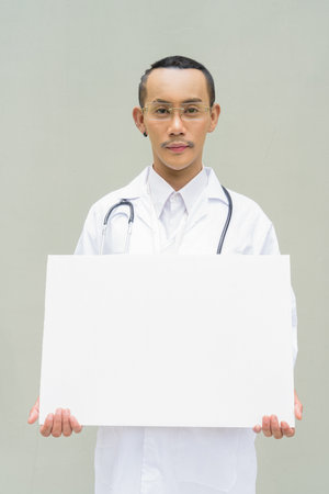 Portrait of non binary gay man doctorの写真素材