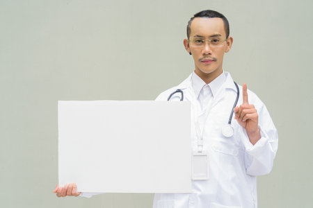 Portrait of non binary gay man doctorの写真素材