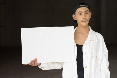 Portrait of non binary young handsome gay manの写真素材