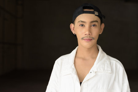 Portrait of non binary young handsome gay manの写真素材