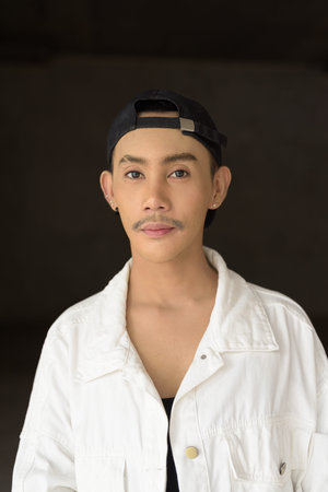 Portrait of non binary young handsome gay man
