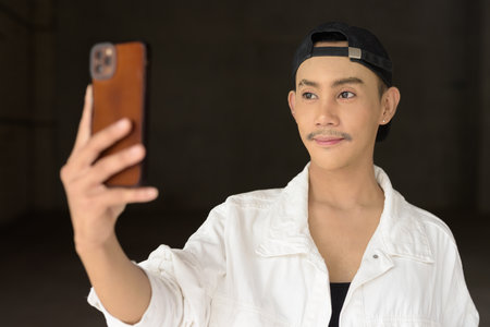 Portrait of non binary young handsome gay manの写真素材