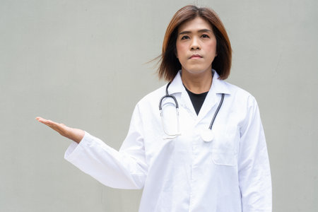 Portrait of Asian transgender non binary doctor with stethoscope. Diversity in healthcare.の写真素材
