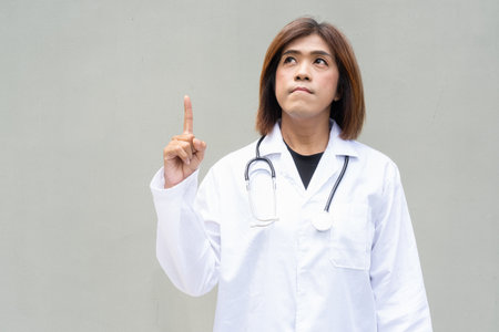 Portrait of Asian transgender non binary doctor with stethoscope. Diversity in healthcare.の写真素材