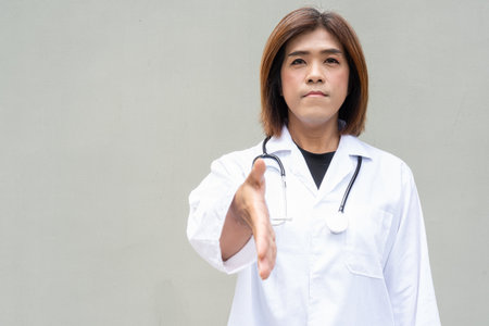 Portrait of Asian transgender non binary doctor with stethoscope. Diversity in healthcare.の写真素材