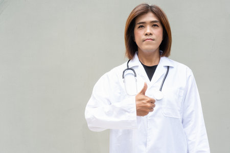 Portrait of Asian transgender non binary doctor with stethoscope. Diversity in healthcare.の写真素材