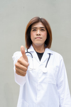 Portrait of Asian transgender non binary doctor with stethoscope. Diversity in healthcare.の写真素材
