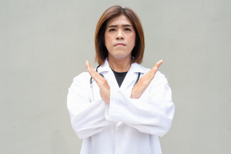 Portrait of Asian transgender non binary doctor with stethoscope. Diversity in healthcare.の写真素材